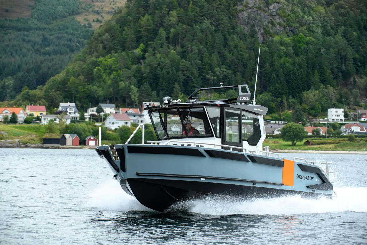 OXpro A8 at speed in front of the hillside in Ulsteinvik